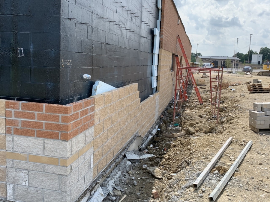 corner of a building being bricked